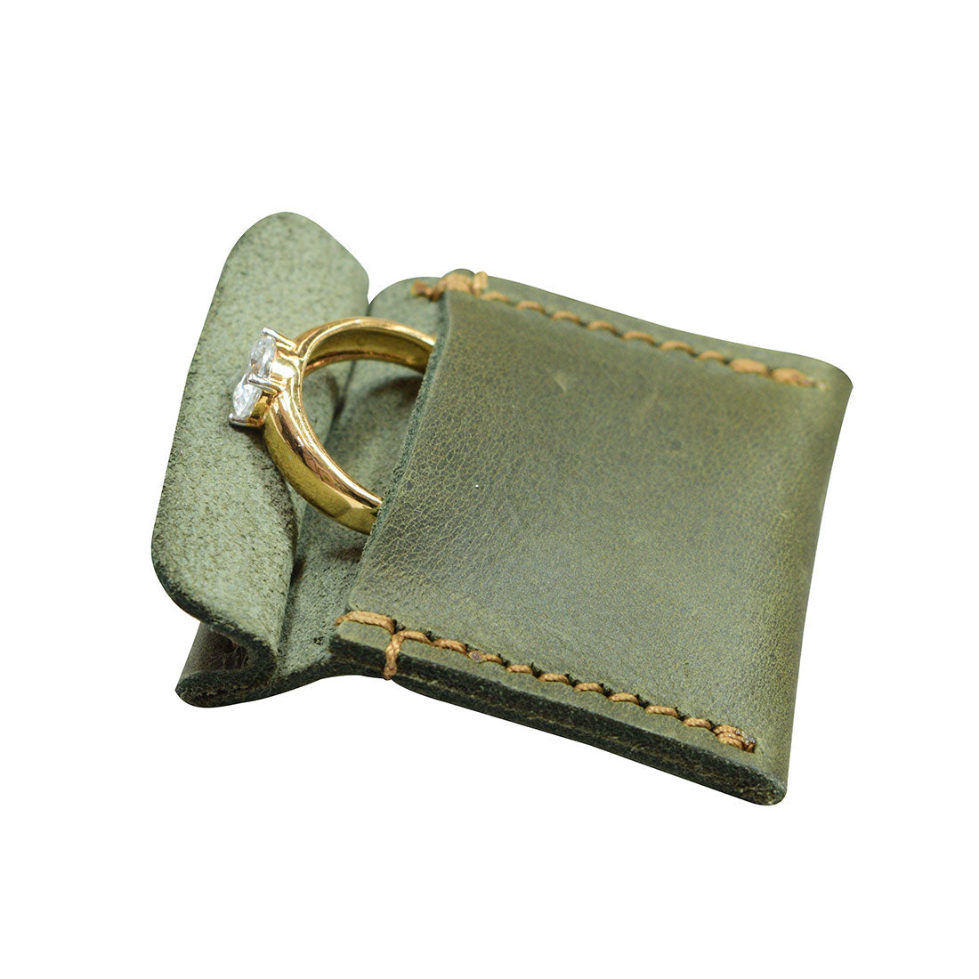 Hide & Drink Wedding Ring Case in a stylish blue hue, displaying an engagement ring. Perfect for travel, this pouch organizer for jewelry is a small batch production, handcrafted in La Antigua Guatemala & Oaxaca Mexico.