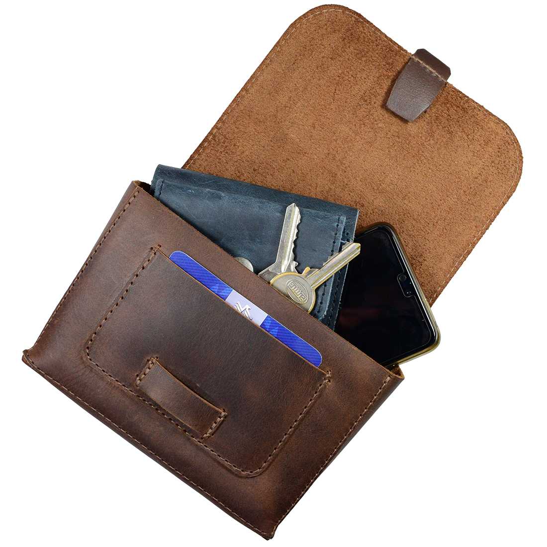 Interior view of Hide & Drink's Squared Fanny Pack showcasing the spacious compartment for essentials. This Full Grain Leather travel accessory is designed for both men and women, with an Adjustable Strap for comfort. Embrace artisan craftsmanship with this handmade bag, made from high-quality materials in small batch production in La Antigua Guatemala & Oaxaca Mexico.