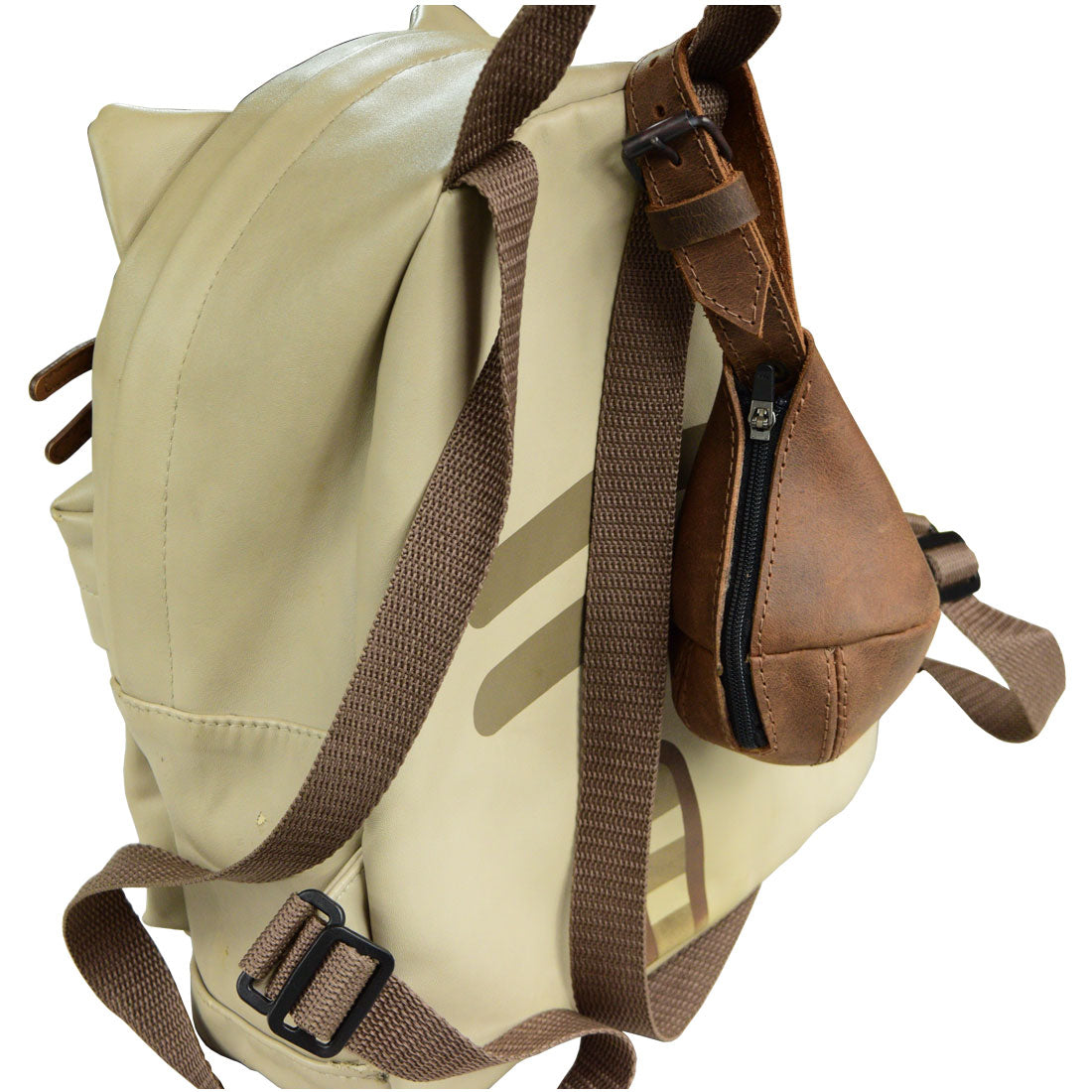 The Drop Shape Case by Hide & Drink attached to a backpack, emphasizing its practicality. This versatile piece, made from Full Grain Leather, functions as a multipurpose hanging bag, coin cash pouch, key organizer, and cable holder, crafted with care in La Antigua Guatemala & Oaxaca Mexico.