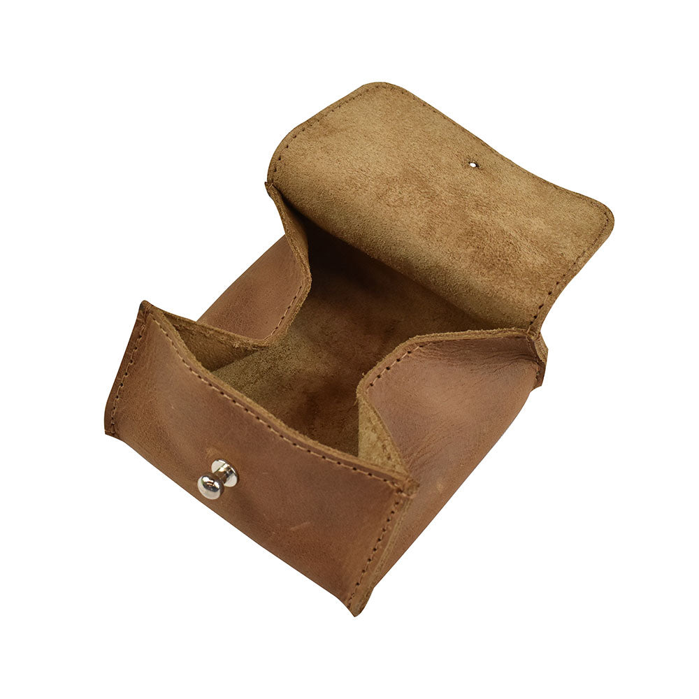 View of the inside of a Hide & Drink Jewelry Pouch ready for storage of rings and other precious keepsakes. Highlighted features include full grain leather craftsmanship and the pouch's versatility as a wedding gift.