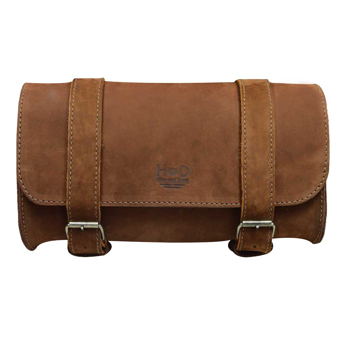 Hide & Drink Leather Motorcycle Tool Bag display showcasing the sturdy exterior, made with Full Grain Leather, perfect for any biker needing a reliable Biker Bag for Tools and Essentials. Designed as a Handlebar Bag with Adjustable Straps, it provides an effective Tool Organizer, crafted through Hand Cut, Hand Sewn techniques in La Antigua Guatemala & Oaxaca Mexico.