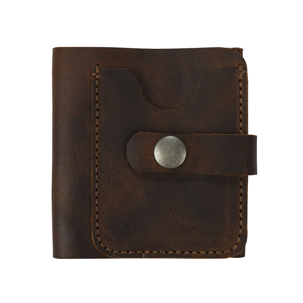 Showcasing the Minimalist Bi-fold Wallet by Hide & Drink, made from Full Grain Leather. This wallet is designed to hold up to 5 cards plus flat bills, highlighting its sleek and functional style. Perfect as an everyday accessory, this handcrafted wallet exemplifies small batch production, being hand cut and hand sewn by artisans in La Antigua Guatemala & Oaxaca Mexico.