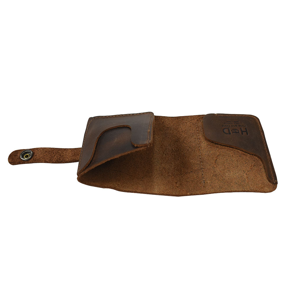 An inside perspective of the Minimalist Bi-fold Wallet by Hide & Drink, revealing its spacious compartments for cards and cash. This wallet, made from Full Grain Leather, holds up to 5 cards plus flat bills, perfect for anyone seeking an everyday accessory. Hand cut and hand sewn by artisans in small batch production, it embodies quality craftsmanship in La Antigua Guatemala & Oaxaca Mexico.