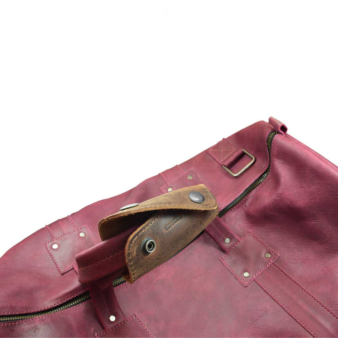 Another angle of the Hide & Drink Handle Grip Replacement, displaying its sturdy construction designed for comfort and ease of use in luggage. This handmade item is crafted from premium Full Grain Leather, making it a must-have for travel enthusiasts seeking quality and style in their accessories. Ideal as a Handle Grip Replacement for Luggage Bags.