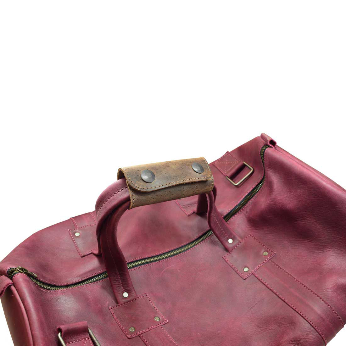 A close-up view of a rustic leather Handle Grip Replacement by Hide & Drink, showcasing its classic design perfect for luggage bags. Made from Full Grain Leather, this artisan-crafted accessory adds a stylish touch to travel gear while ensuring durability. Suitable for anyone looking for a high-quality Handle Grip Replacement for Luggage Bags, Travel Accessories, Full Grain Leather.