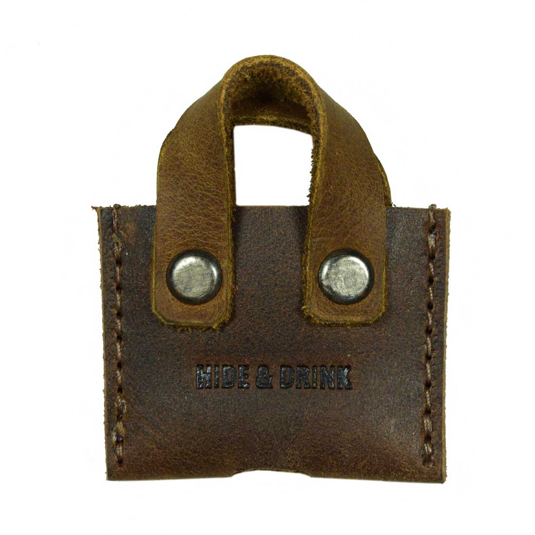 Hide & Drink's Mini Bags Key Cover (3 pack) features a single brown mini bag key cover made from soft, full grain leather. An ideal keychain organizer, this unique gift showcases artisan skills in small batch production, handcrafted in La Antigua Guatemala & Oaxaca Mexico.