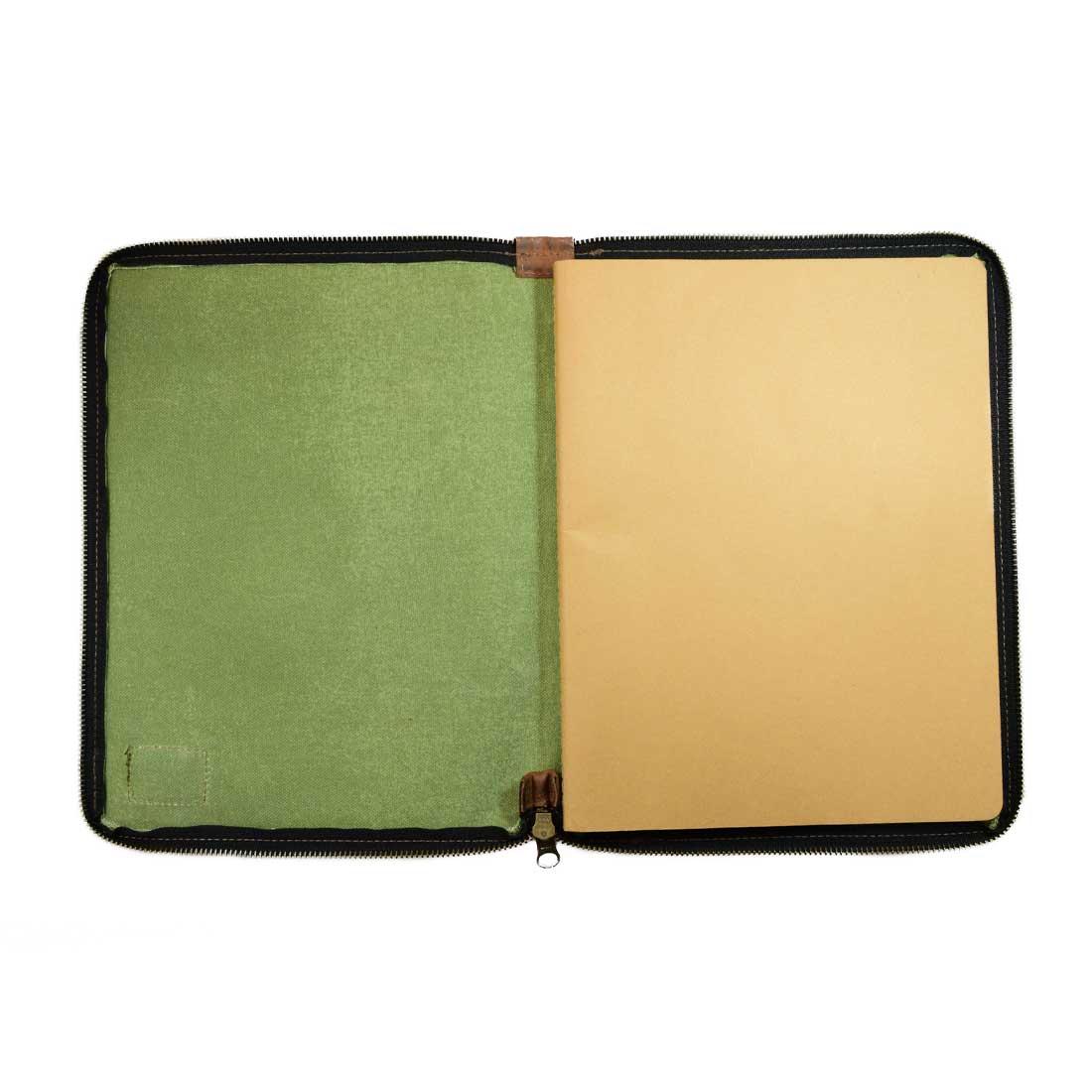 Inside of the Waxed Canvas Zippered Journal Cover for Moleskine (Notebook NOT Included) by Hide & Drink, with a blank page and a soft green Canvas lining. Perfect Cahier Case for creatives. Features durable Full Grain Leather and artisan-made quality in La Antigua Guatemala & Oaxaca Mexico.