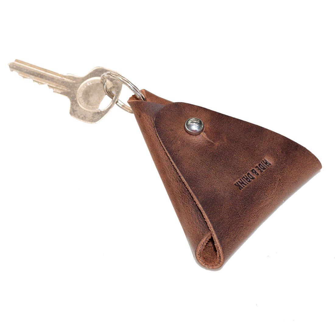 Hide & Drink Triangular Coin Keychain in brown Full Grain Leather, serving as a stylish key ring and holder. Artisan-made, hand-cut and sewn, this pouch showcases small batch production from La Antigua Guatemala & Oaxaca Mexico.
