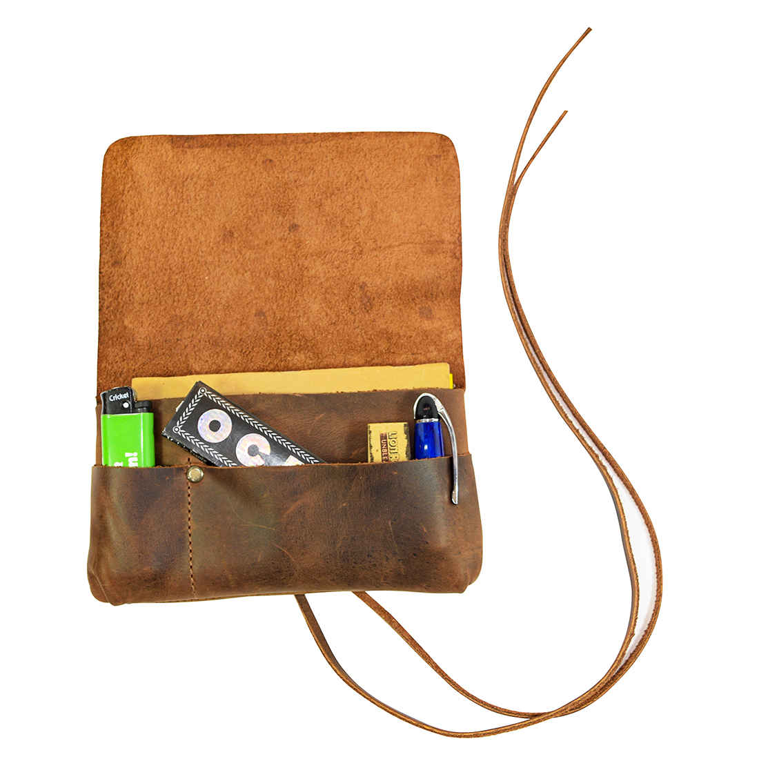 Open King Size Tobacco Pouch by Hide & Drink revealing storage for tobacco and rolling accessories. This handmade Full Grain Leather pouch stands out as a rustic Field Notes Case, designed by artisans in La Antigua Guatemala.