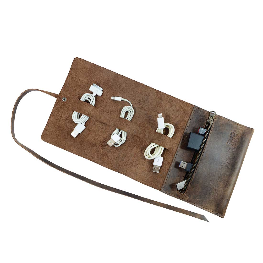 Hide & Drink Cord Pouch, an artisan handmade travel bag made of full grain leather, features multiple slots for organizing cables, making it an ideal cord wrap and cable holder. Small batch production crafted by skilled artisans in La Antigua Guatemala & Oaxaca Mexico.