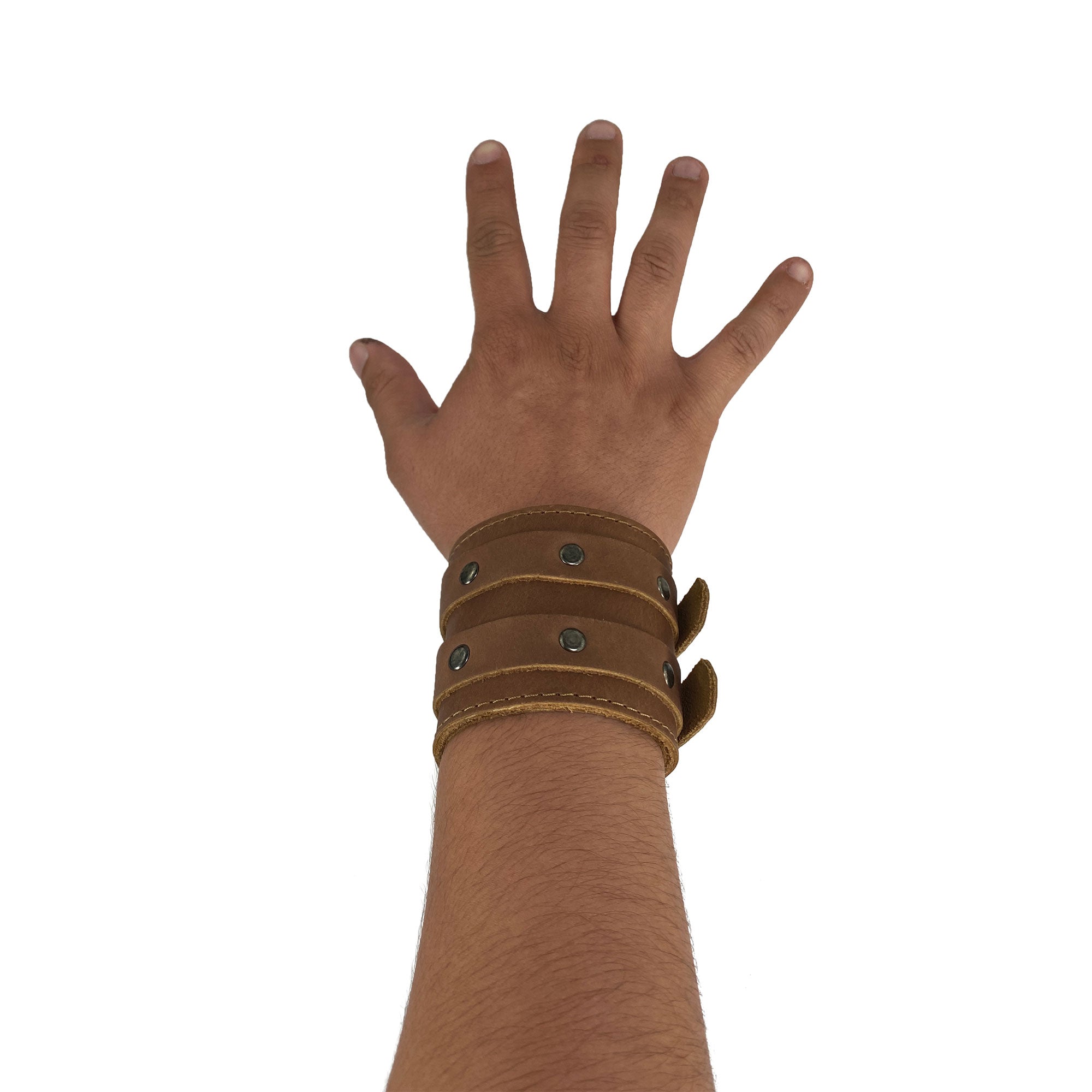 Wrist-Wallet-Cuff by Hide & Drink worn on a hand, demonstrating its stylish and functional design ideal for travel, created in the artisan tradition of StockyardX with Full Grain Leather, hand cut, and hand sewn, featuring craftsmanship from La Antigua Guatemala & Oaxaca Mexico.