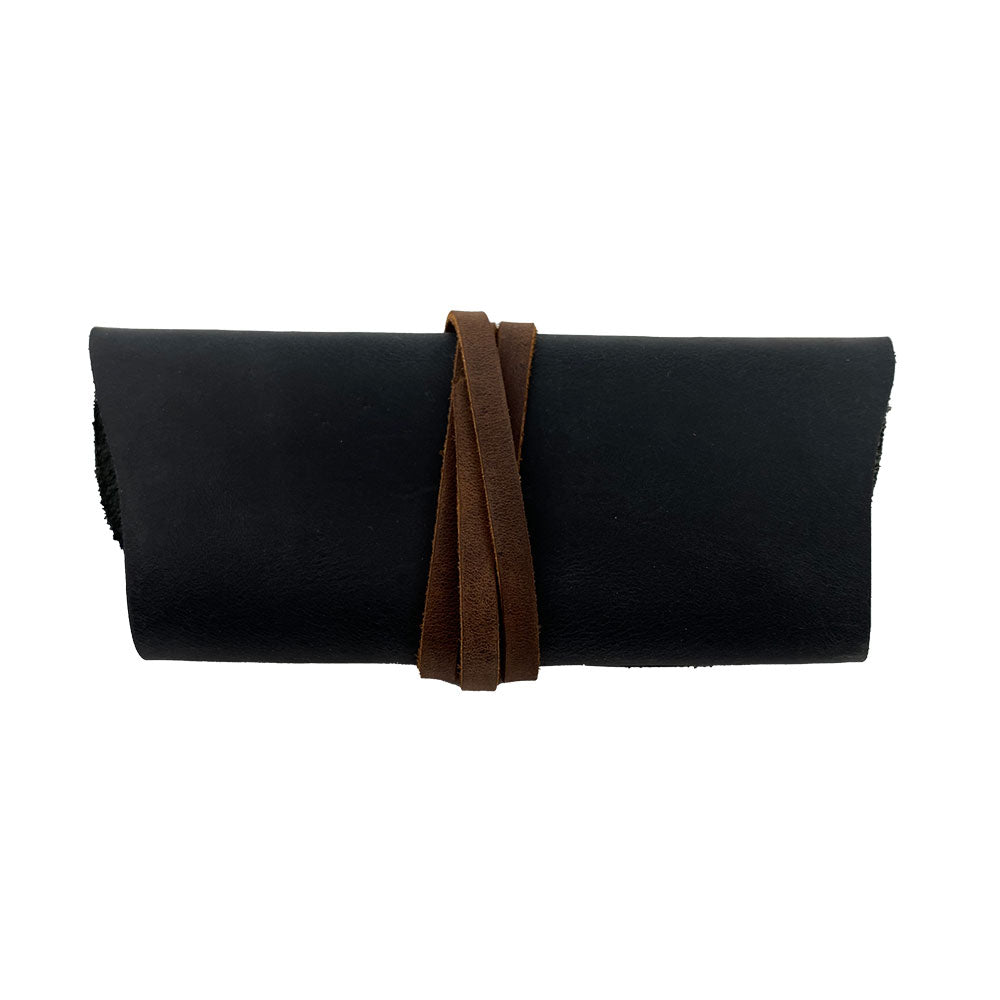 Hide & Drink Sunglass Wrap serves as a stylish and functional eye glasses storage. Crafted from full grain leather, it protects your sunglasses during travel. Artisan made, hand cut, and sewn in La Antigua Guatemala.