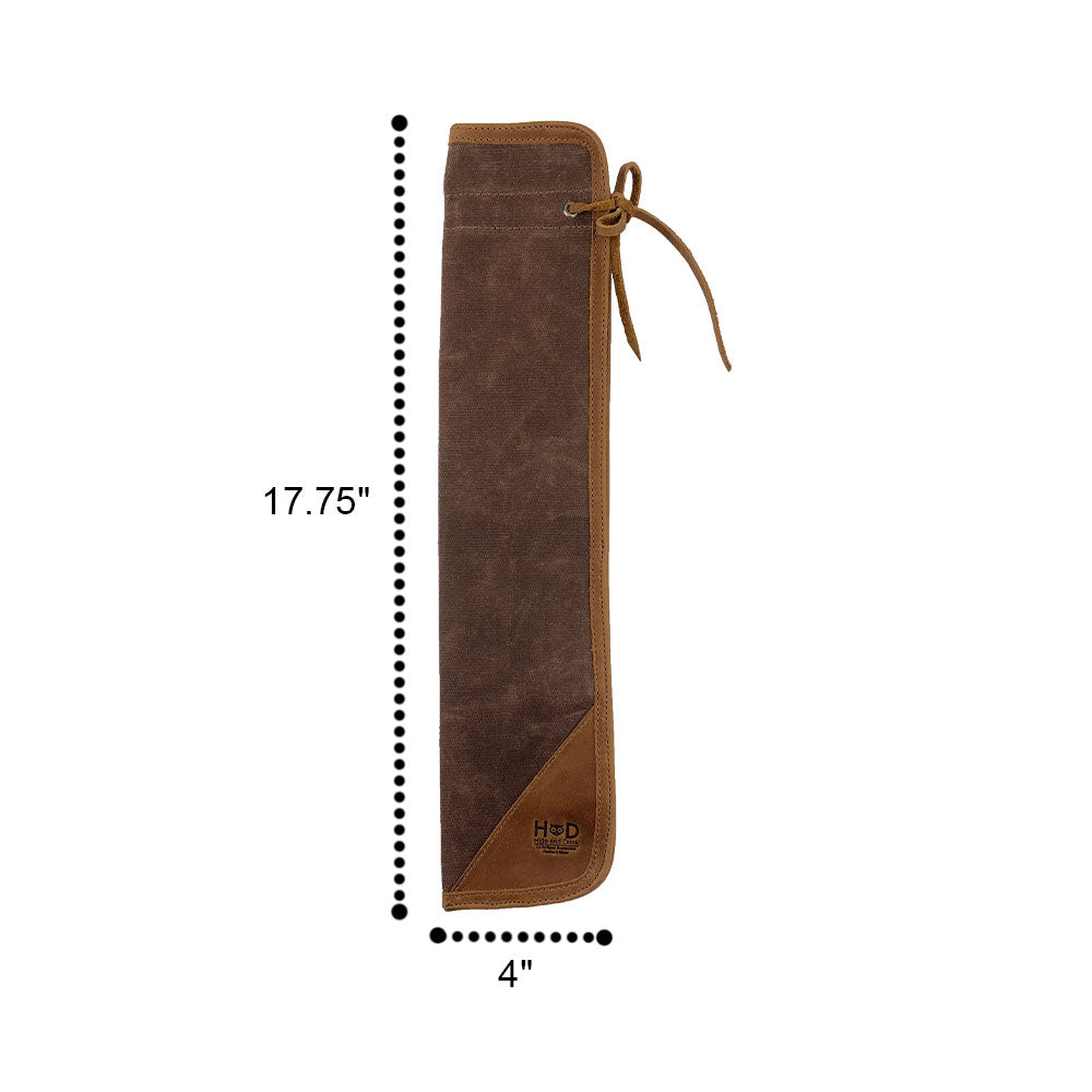 The brown Hide & Drink Drummstick Bag displayed, showcasing its high-quality Waxed Canvas & Full Grain Leather design. This essential Drumstick Bag Holder is perfect for musicians, embodying the dedication to artisan craftsmanship from small batch production in La Antigua Guatemala & Oaxaca Mexico.