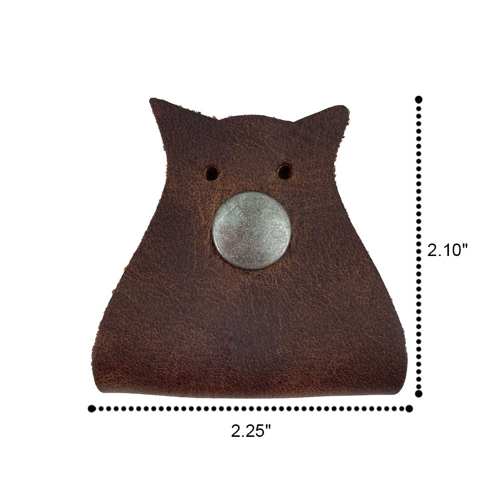 Owl Shaped Cord Keeper (2-Pack) by Hide & Drink showcasing the interactive design and rich leather texture, ideal for neat cable management. Owl Shaped Cord Keeper (Cord Clam) 2-Pack. Full Grain Leather, StockyardX, Small Batch Production, Hand Cut, Hand Sewn, Fire Branded, Artisan, Handmade in La Antigua Guatemala & Oaxaca Mexico.