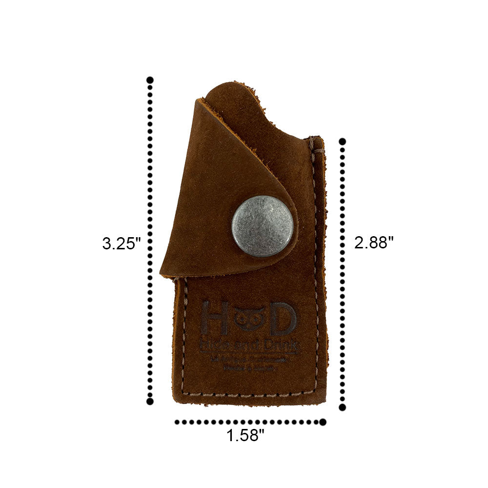 Dimensional view of the Hide & Drink Lighter Protective Case, highlighting its compact size suitable for everyday carry. Handcrafted in full grain leather by artisans in La Antigua Guatemala & Oaxaca Mexico. Keywords: Lighter Protective Case, Full Grain Leather, Artisan.