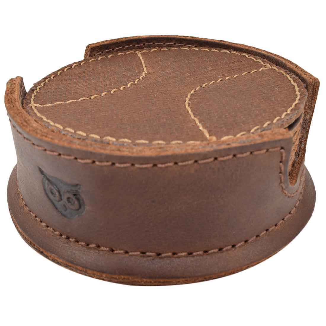 A close-up view of a Waxed Canvas & Full Grain Leather coaster holder for the Hide & Drink All Baseball Coaster (8-Pack). This elegant holder showcases high-quality craftsmanship designed for table and home use, providing excellent stain protection while being handmade in La Antigua Guatemala & Oaxaca Mexico.