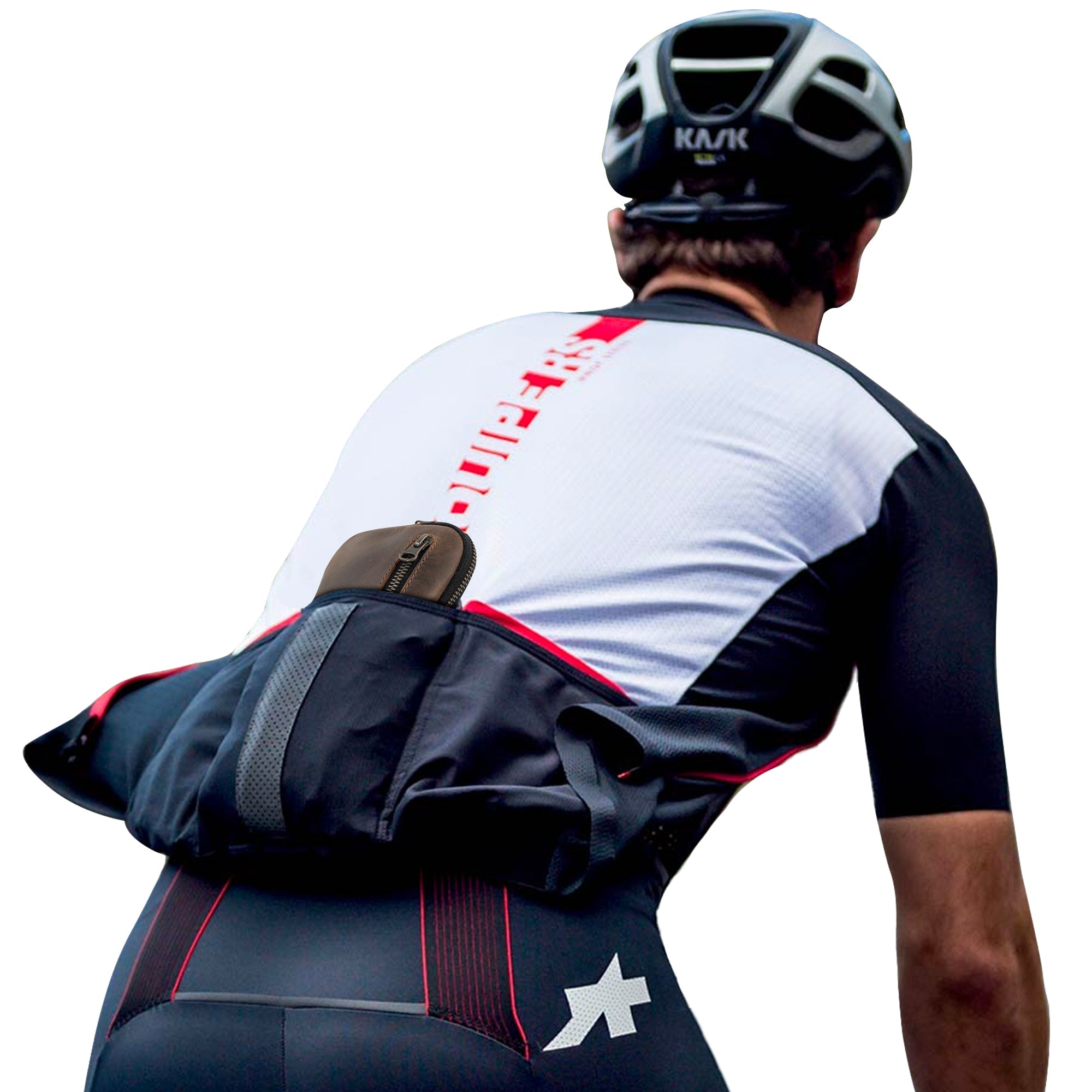 Cyclist wearing Hide & Ride Cycling Phone Bag securely fitted in their gear, showcasing its functionality as a utility bag for small tools. This durable pouch is perfect for cell phone wallets and personal items, crafted from full grain leather and handmade in La Antigua Guatemala.