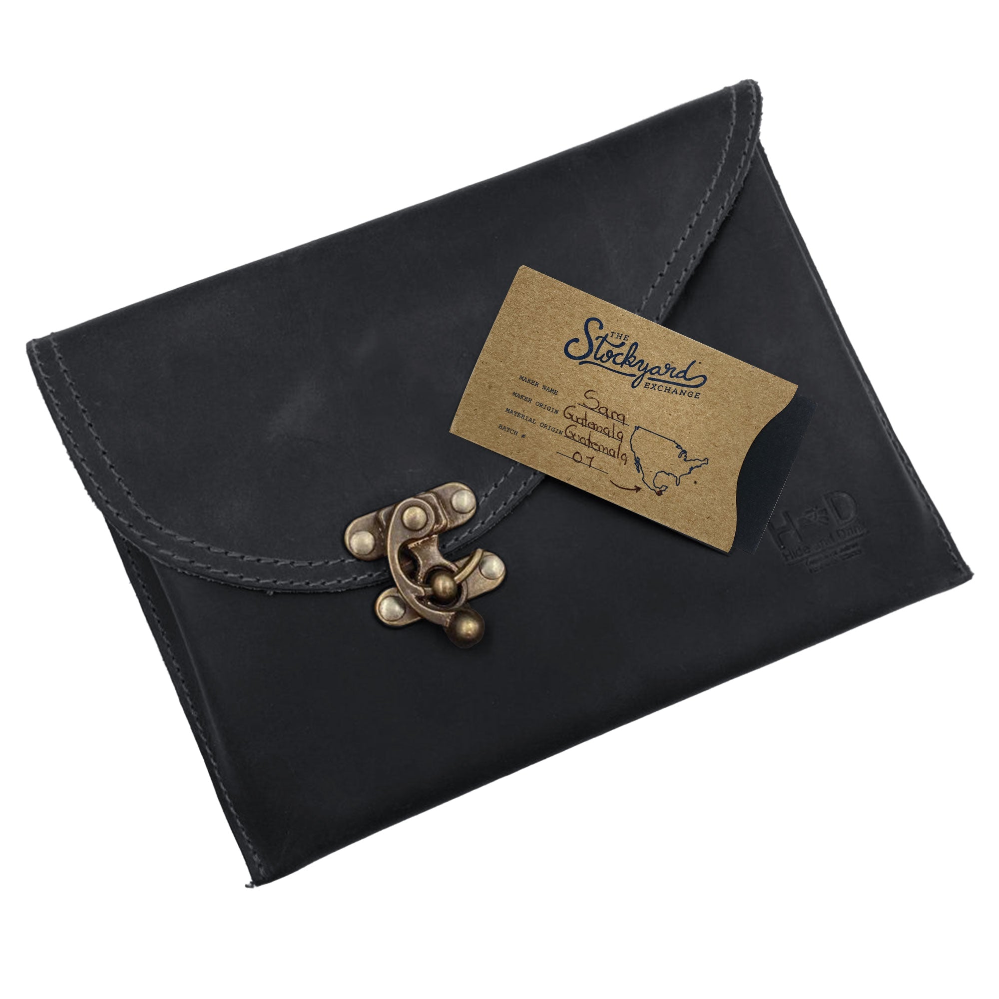 The Petite Vintage Clutch Bag by Hide & Drink is beautifully presented with a business card, emphasizing its handmade craftsmanship. This exquisite evening bag is made from full grain leather and showcases the artistry of small batch production, handmade in La Antigua Guatemala & Oaxaca Mexico.
