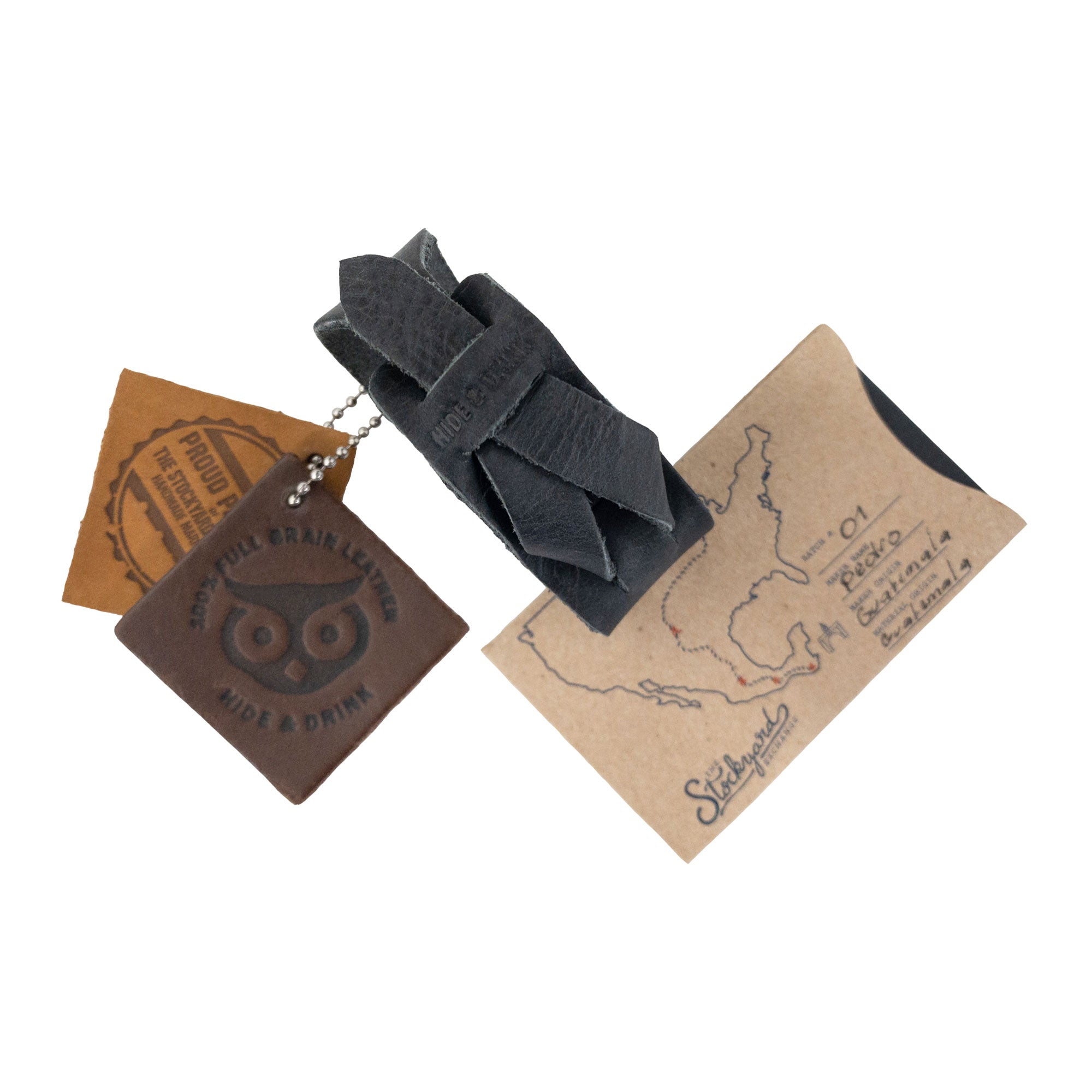 Hide & Drink’s Minimalist Wristband with included leather tags showing quality craftsmanship. This black rustic bracelet features an adjustable strap, embodying the artisan spirit of small batch production in La Antigua Guatemala by StockyardX.