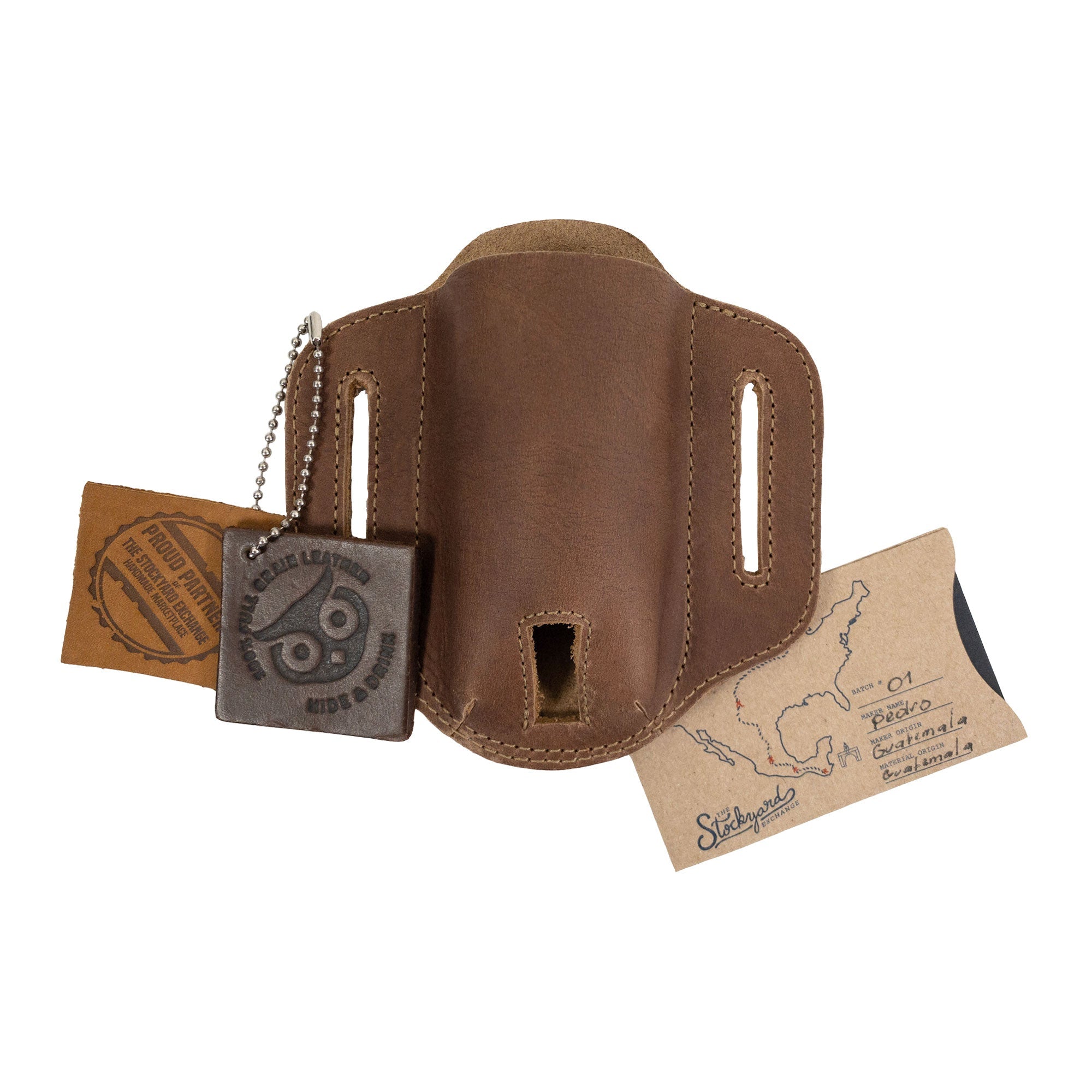 Tag accompanying the brown Multitool Belt Sheath from Hide & Drink, showcasing its artisan roots. This pocket knife set case is a durable outdoor accessory made from high-quality full grain leather, ideal for everyday carry.