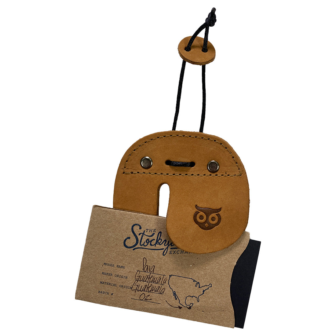 The Right Handed Archery Finger Protector from Hide & Drink is showcased with its accessories, underlining its artisan quality. This finger protector, made from premium full grain leather, serves as an effective protect guard for recurve bows during shooting practice. Handmade in La Antigua Guatemala with special attention to detail, it features small batch production and fire-branded designs.