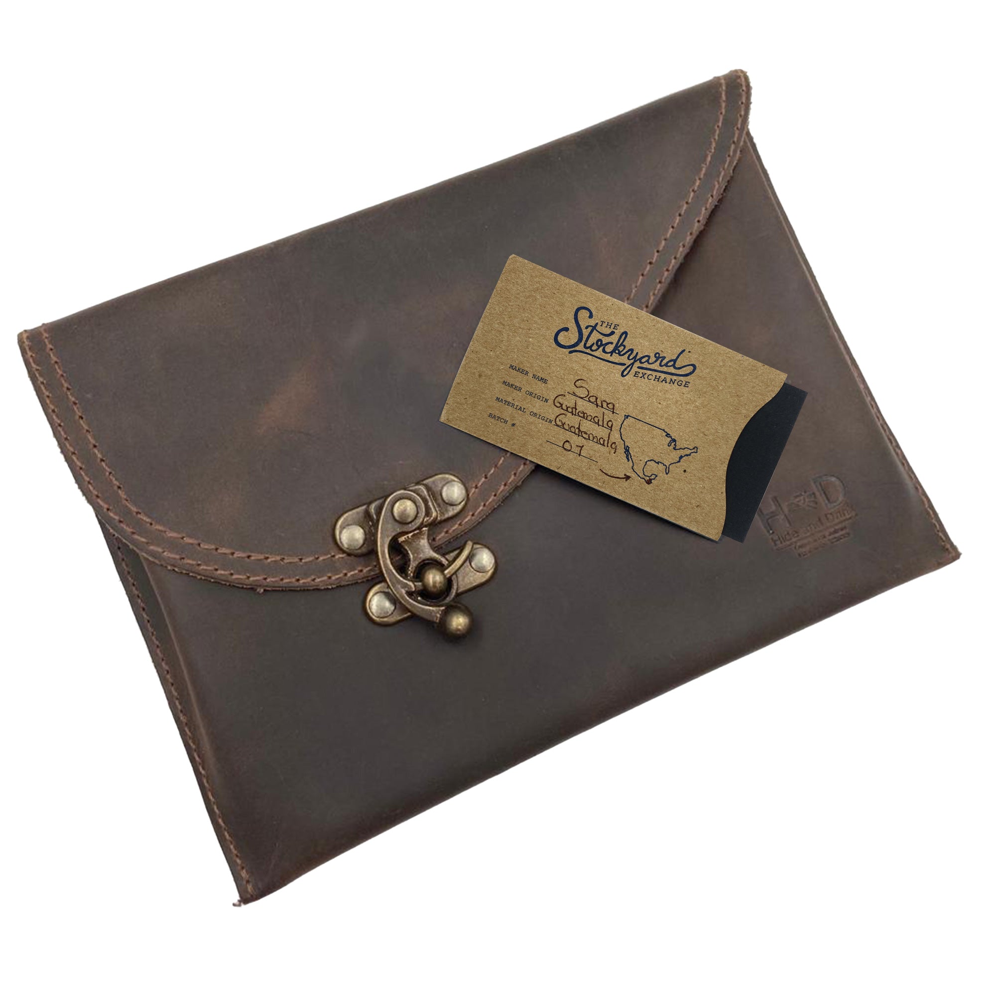 The Petite Vintage Clutch Bag by Hide & Drink, adorned with a business card showcasing its artisan origins. This beautiful evening bag, crafted from full grain leather, reflects the quality of small batch production and handmade craftsmanship from La Antigua Guatemala & Oaxaca Mexico.