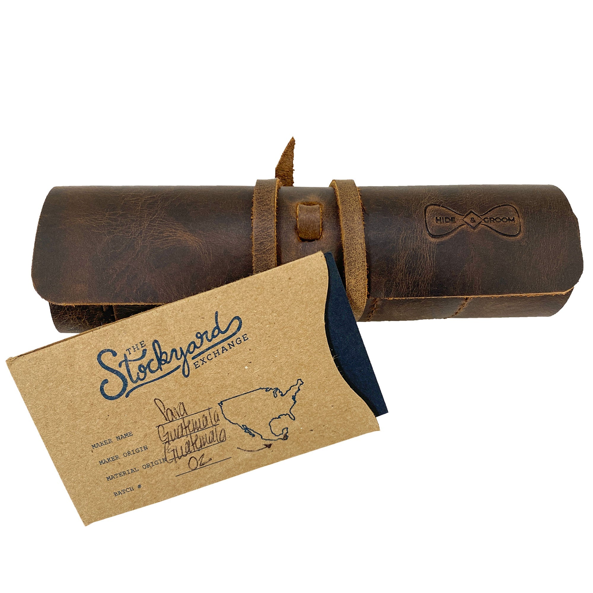 Hide & Groom Shaving Brush Roll, a sophisticated full grain leather item for effectively organizing shaving tools while traveling. Handmade in La Antigua Guatemala, this minimalist toiletry organizer emphasizes artisan craftsmanship through small batch production, showcasing hand cut, hand sewn details and fire branding.