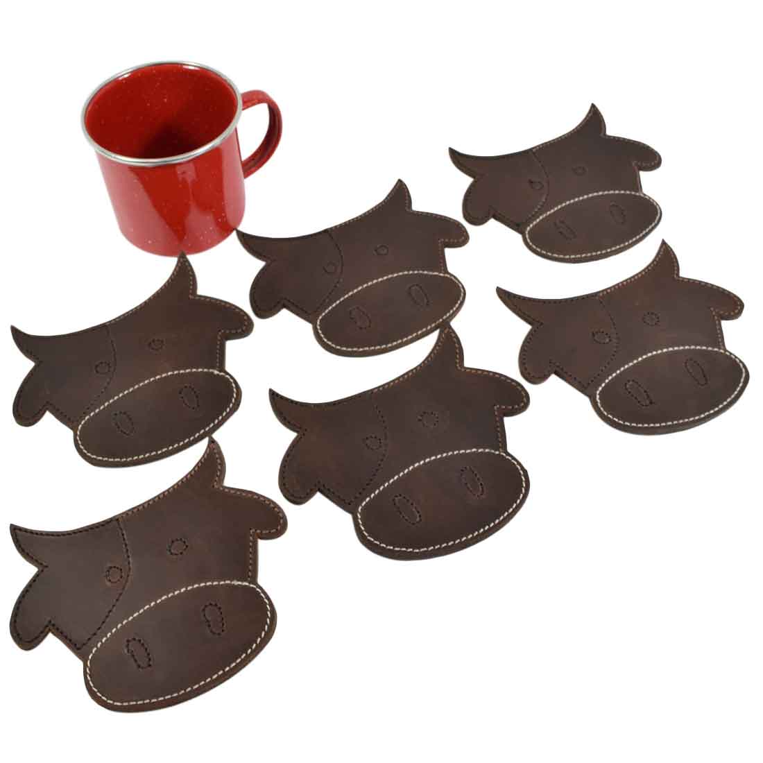 The complete Milk Cow Coaster Set (6-Pack) by Hide & Drink displayed with a red mug, highlighting the adorable cow-shaped coasters made from thick leather. Each piece is handcrafted to ensure durability and style, perfect for any coffee table. Durable Thick Leather Milk Cow/Animal Farm Cute Shaped Coasters (6-Pack) Full Grain Leather, StockyardX, Small Batch Production, Hand Cut, Hand Sewn, Fire Branded, Artisan, Handmade in La Antigua Guatemala & Oaxaca Mexico.
