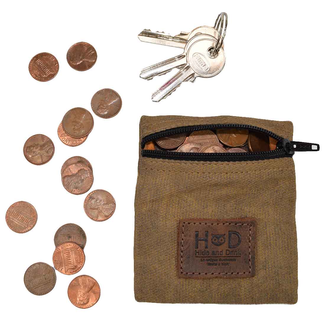 Hide & Drink Condom Pouch filled with coins and keys, crafted from durable water resistant waxed canvas. Perfect for storing change or valuables, this small artisan pocket purse makes a great classic partner gift. Ideal for travel and honeymoon essentials, handmade in La Antigua Guatemala, featuring fire branded craftsmanship.