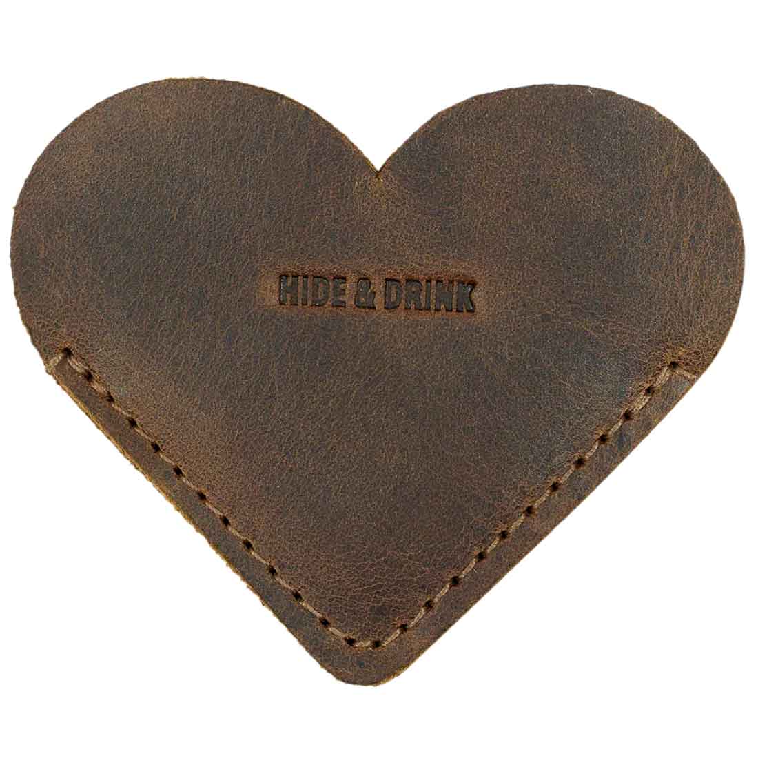 Top view of the Leather Corner Heart Bookmark (2 pack) by Hide & Drink, highlighting its Full Grain Leather texture. This handmade item represents small batch production and artisan craftsmanship, made in La Antigua Guatemala and Oaxaca Mexico.