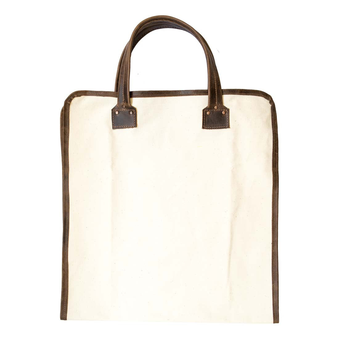 Hide & Drink Firewood Bag shown in a clean, upright position emphasizing its practical design and sturdy leather handle. Firewood Bag With Leather Liner, Full Grain Leather, StockyardX, Small Batch Production, Hand Cut, Hand Sewn, Fire Branded, Artisan, Handmade in La Antigua Guatemala & Oaxaca Mexico.