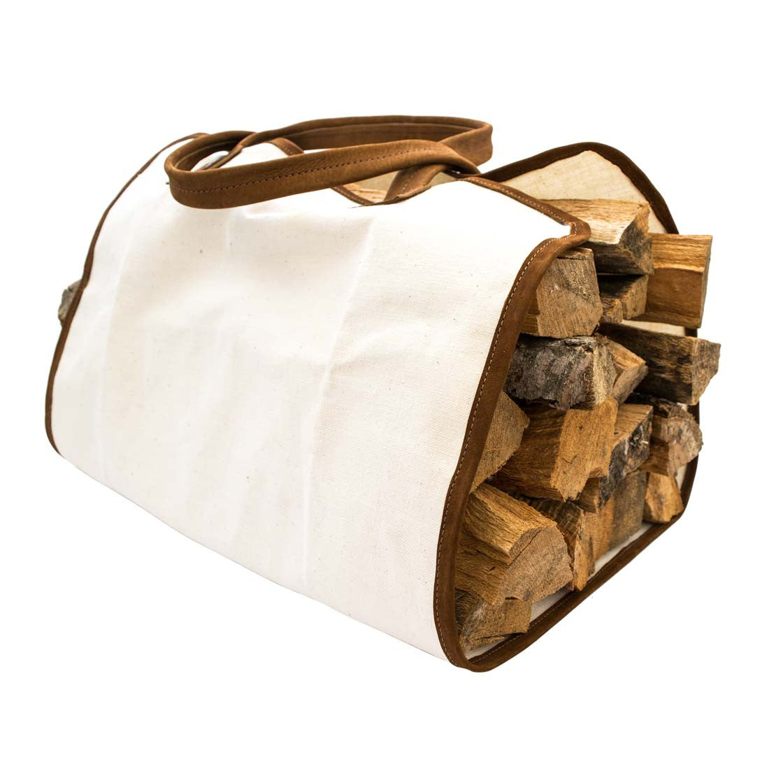 Hide & Drink Firewood Bag filled with logs, featuring the stylish combination of durable canvas and rich leather, perfect for transporting firewood. Firewood Bag With Leather Liner, Full Grain Leather, StockyardX, Small Batch Production, Hand Cut, Hand Sewn, Fire Branded, Artisan, Handmade in La Antigua Guatemala & Oaxaca Mexico.