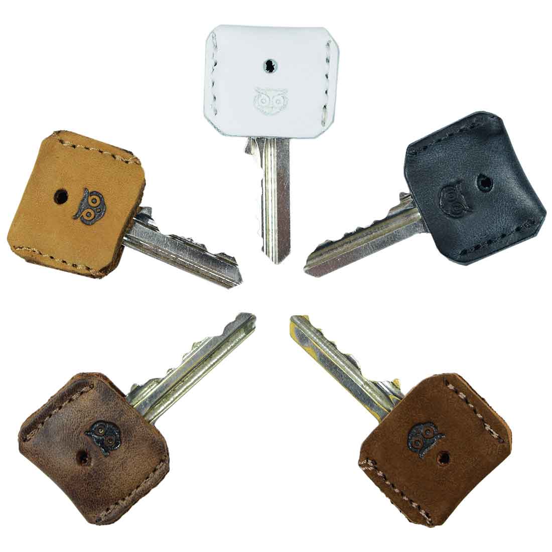 Stylish set of 5 Key Covers from Hide & Drink featuring unique full grain leather designs. These key protectors showcase small batch production craftsmanship with hand cut, hand sewn, and fire branded details. Perfect for personalizing your keys with an artisan touch, handmade in La Antigua Guatemala & Oaxaca Mexico.