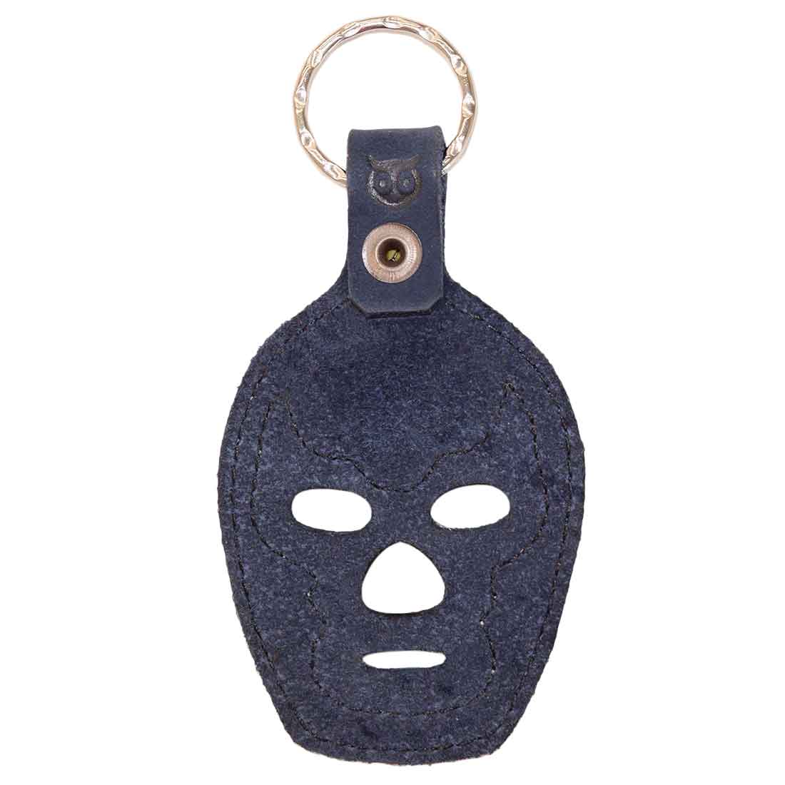 The back view of the Luchador Mask Leather Keychain in durable dark suede, ideal for a unique keyring solution. Crafted by Hide & Drink, this key organizer is an excellent travel accessory made from high-quality full grain leather, embodying small batch production. Each piece is hand cut, hand sewn, and fire branded by artisans in La Antigua Guatemala and Oaxaca Mexico.