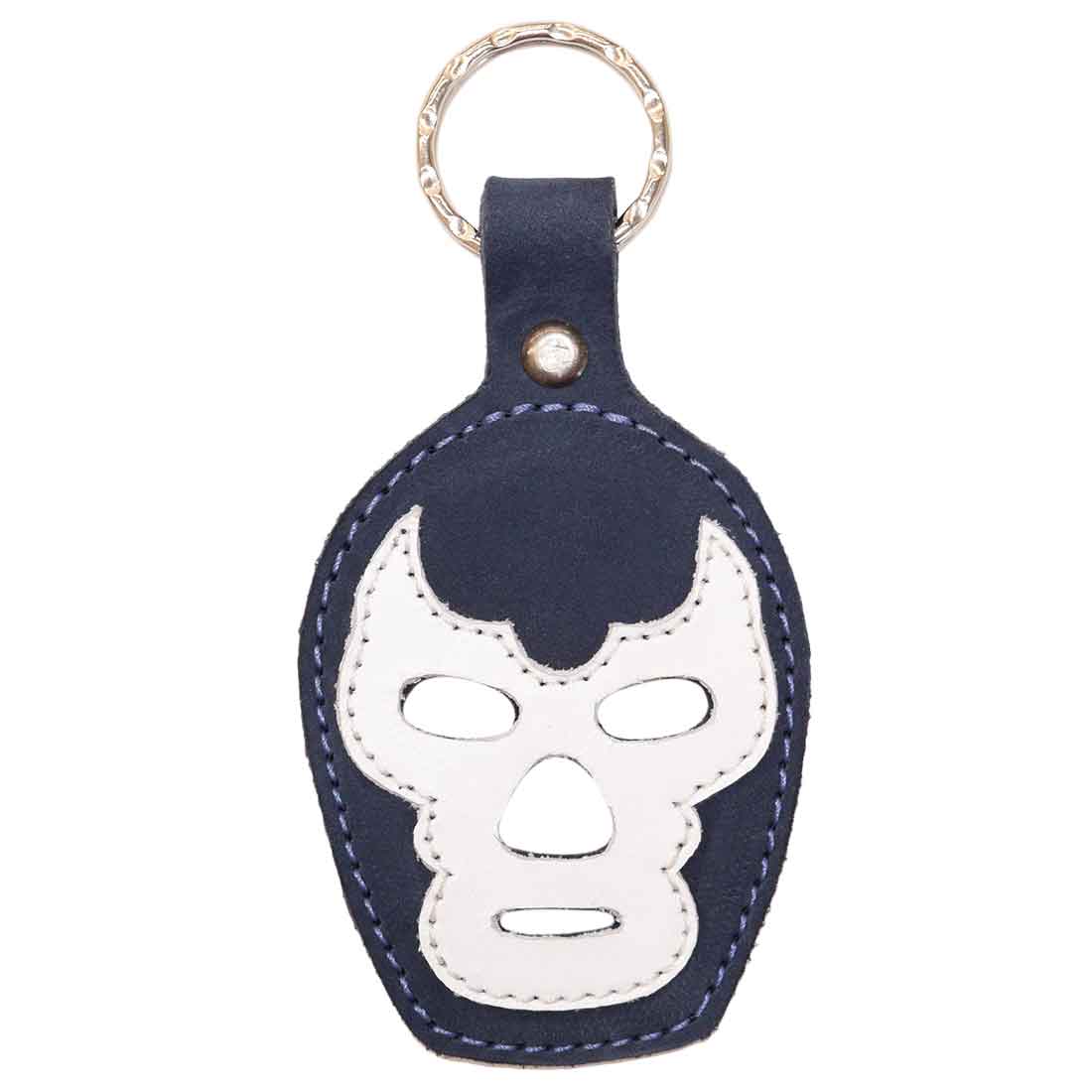 A stylish Luchador Mask Leather Keychain in navy blue and white, featuring a keyring for easy attachment. This durable key organizer is made from full grain leather and reflects the craftsmanship of Hide & Drink. Perfect as a travel accessory, this artisan piece is hand cut and hand sewn, showcasing small batch production handmade in La Antigua Guatemala and Oaxaca Mexico.