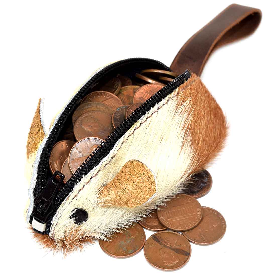 The Hide & Drink Mouse Coin Pouch in action, filled with coins, serves as an ideal travel accessory. Its delightful mouse design and quality full grain leather make this change pouch a perfect pocket case for coins, handcrafted in small batches in La Antigua Guatemala.