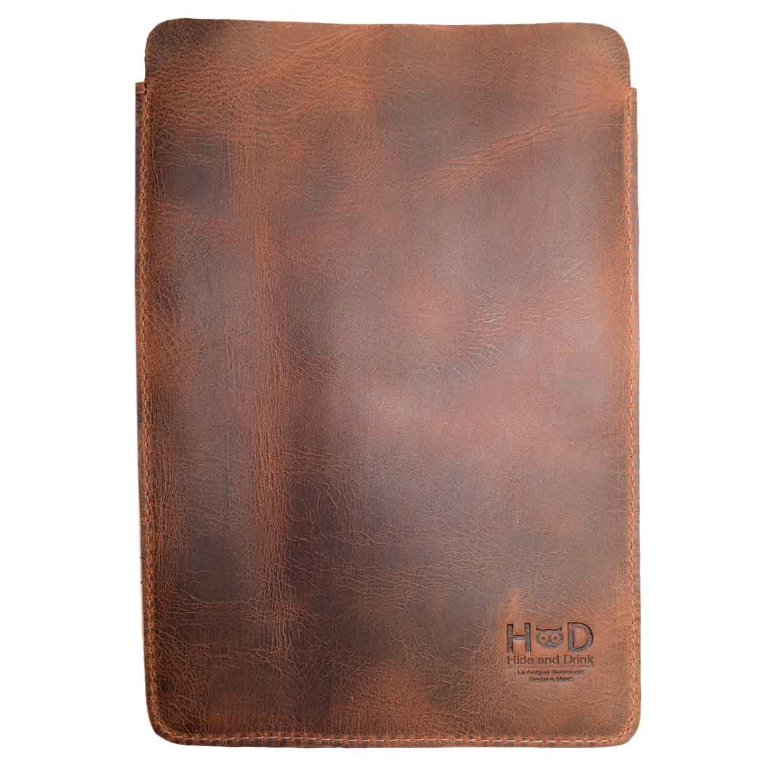 Front view of Hide & Drink's Notebook Sleeve & Pen Holder (5 x 8.5 in.) (Notebook Not Included), featuring gorgeous brown full grain leather and fire branded logo, ideal for anyone looking for a stylish journal cover or diary case, crafted with care in La Antigua Guatemala.