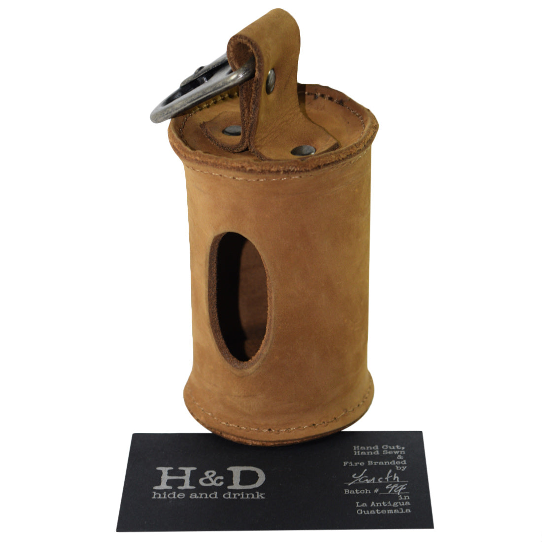 Doggie Bag Dispenser from Hide & Drink displayed alongside branded packaging, highlighting its artisanal quality. This thick full grain leather waste bag holder with a brass metal clip is perfect for stylish dog walkers, handmade in La Antigua Guatemala.