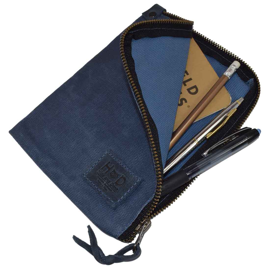 Back view of the navy Scribbler Case by Hide & Drink, made from Waxed Canvas. Perfect for notebook storage, emphasizing small batch production and hand-sewn craftsmanship. Handmade in La Antigua Guatemala & Oaxaca Mexico.