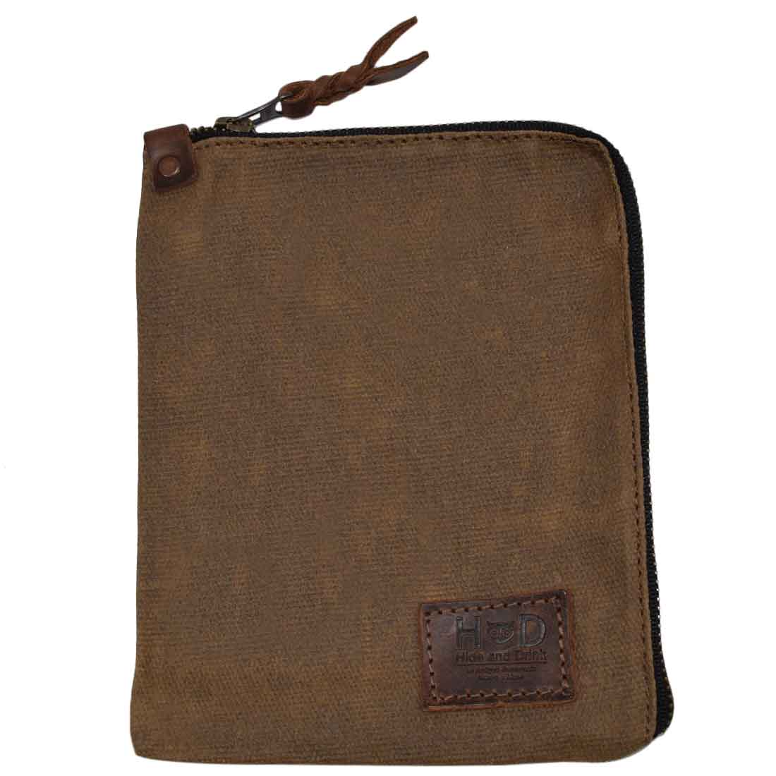 View of the brown Scribbler Case by Hide & Drink, made from Waxed Canvas. Perfect for notebook storage, highlighting small batch production, hand cut, hand sewn, and artisan craftsmanship. Handmade in La Antigua Guatemala & Oaxaca Mexico.