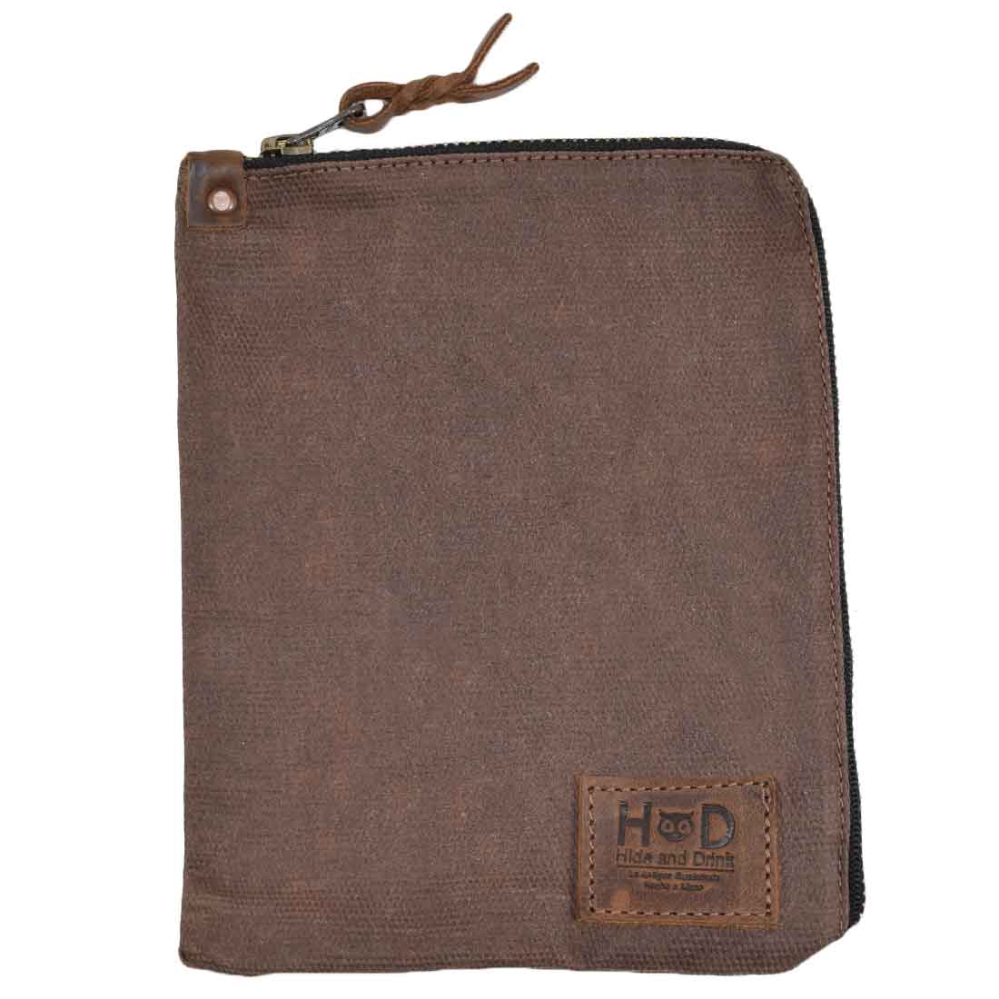 Detailed view of the brown Scribbler Case from Hide & Drink, crafted from Waxed Canvas. Ideal for notebooks, emphasizing small batch production and hand-sewn craftsmanship. Handmade in La Antigua Guatemala & Oaxaca Mexico.