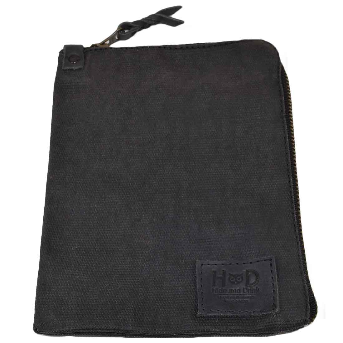 Another angle of the black Scribbler Case from Hide & Drink, crafted with Waxed Canvas. Perfect for notebook storage, emphasizing small batch production and artisan quality. Handmade in La Antigua Guatemala & Oaxaca Mexico.
