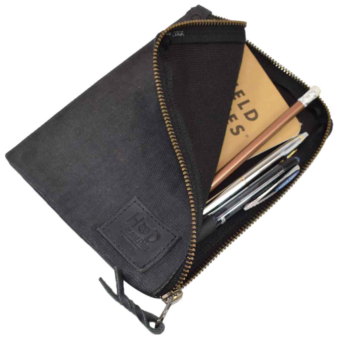 Back view of the black Scribbler Case by Hide & Drink, showcasing Waxed Canvas. Ideal for notebooks, highlighting small batch production, artisan craftsmanship, and durability. Handmade in La Antigua Guatemala & Oaxaca Mexico.