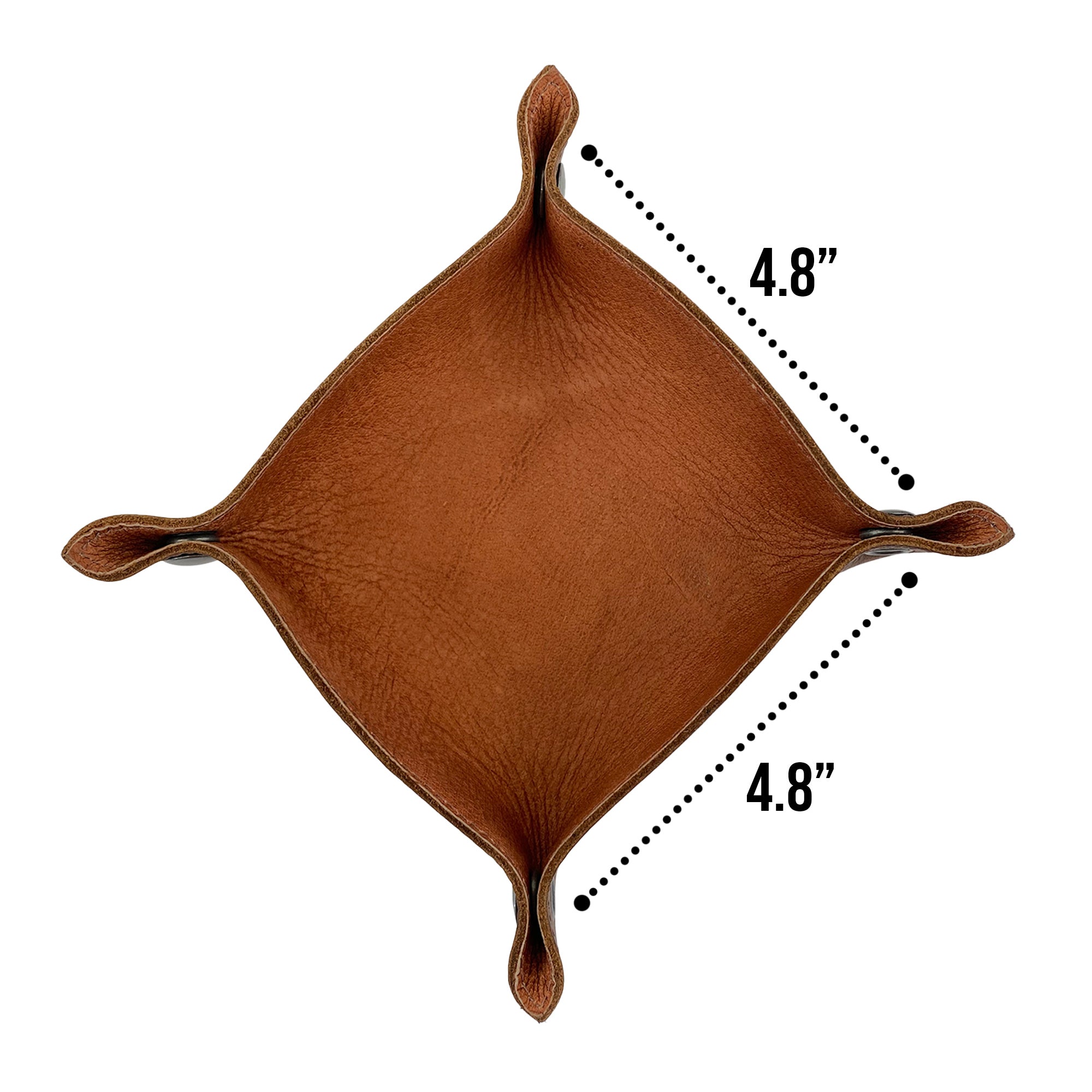 Dimensions of the Squared Catchall by Leather At Home, measuring 4.8 inches by 4.8 inches, highlight its practicality as a catchall for personal items. This handmade valet, produced from high-quality full grain leather, showcases the craftsmanship of artisans in La Antigua Guatemala.