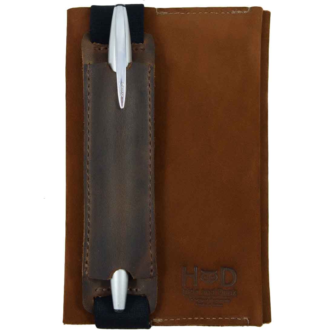 Hide & Drink Pen Holster in brown full grain leather, featuring a pen case with elastic band that fits 6 to 7 inch tall notebooks. This stylish pen pouch showcases handmade craftsmanship from artisans in La Antigua Guatemala & Oaxaca Mexico.