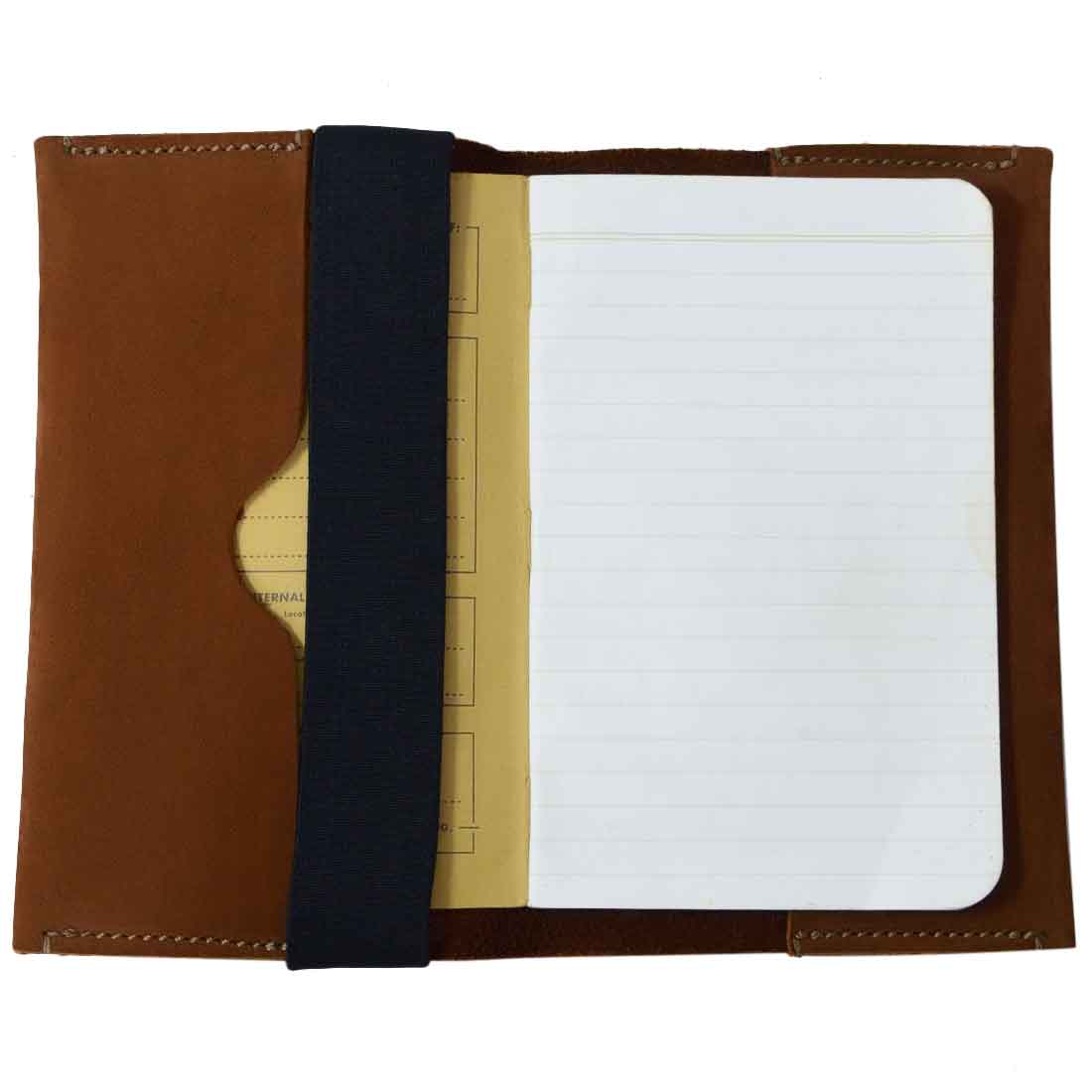 Interior view of Hide & Drink Pen Holster, showcasing a fitted section for a notebook and elastic band, crafted from full grain leather. This artisan-made pen case is perfect for holding 6 to 7 inch notebooks and pens.