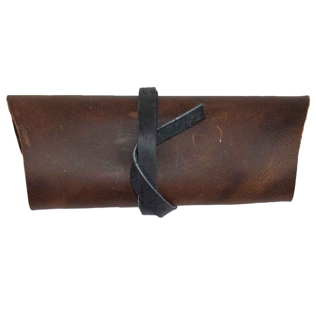 Hide & Drink Sunglass Wrap displays an elegantly wrapped design, made with full grain leather. This artisanal eye glasses storage is perfect for travel, providing secure protection for your sunglasses. Hand cut, hand sewn, and fire branded, it showcases small batch production from La Antigua Guatemala.