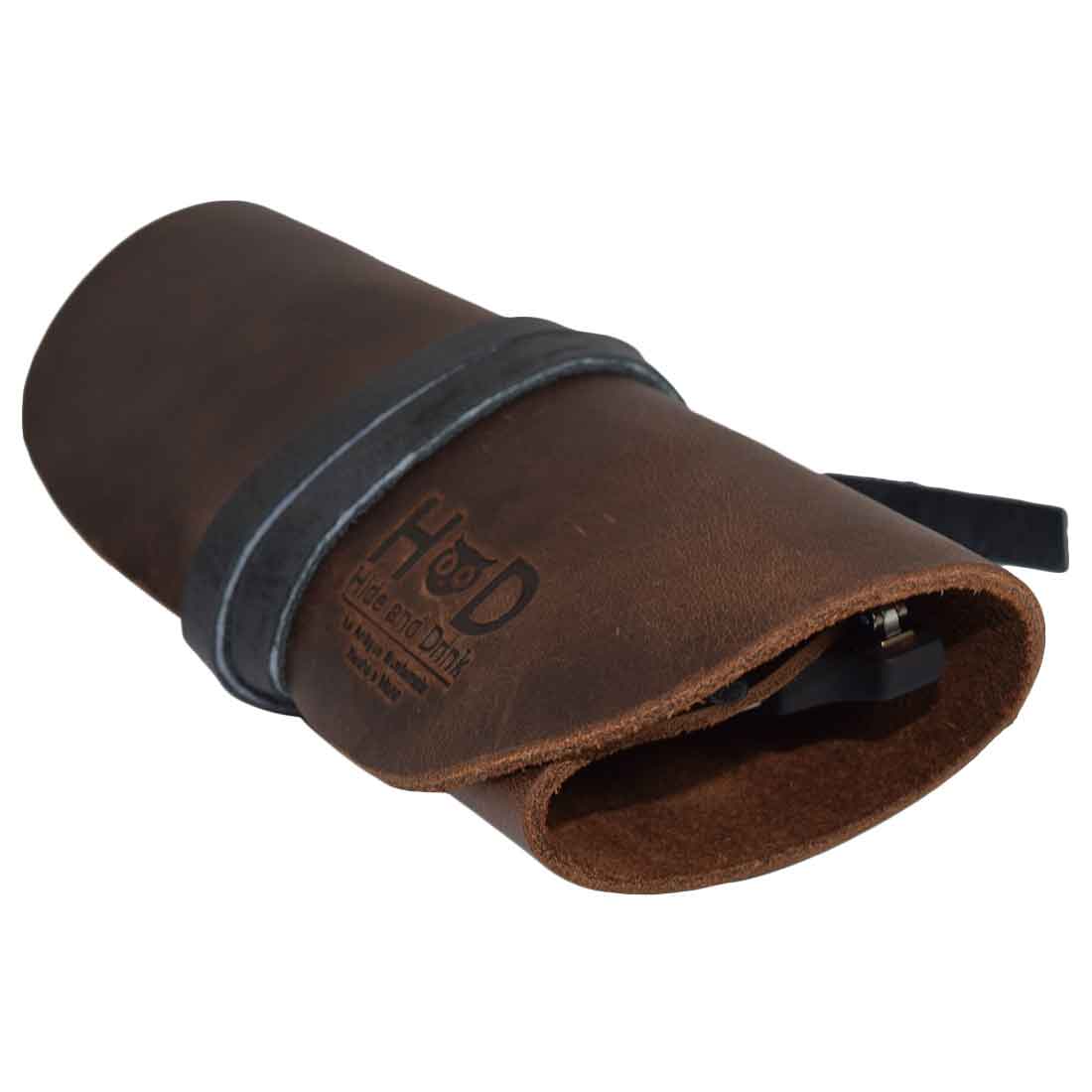 Hide & Drink Leather Sunglass Wrap features a slim design perfect for storing your eyewear. Handmade in La Antigua Guatemala from full grain leather, this stylish sunglass wrap ensures protection from scratches. Ideal for travel, it is artisan crafted, hand cut, and hand sewn for durability.