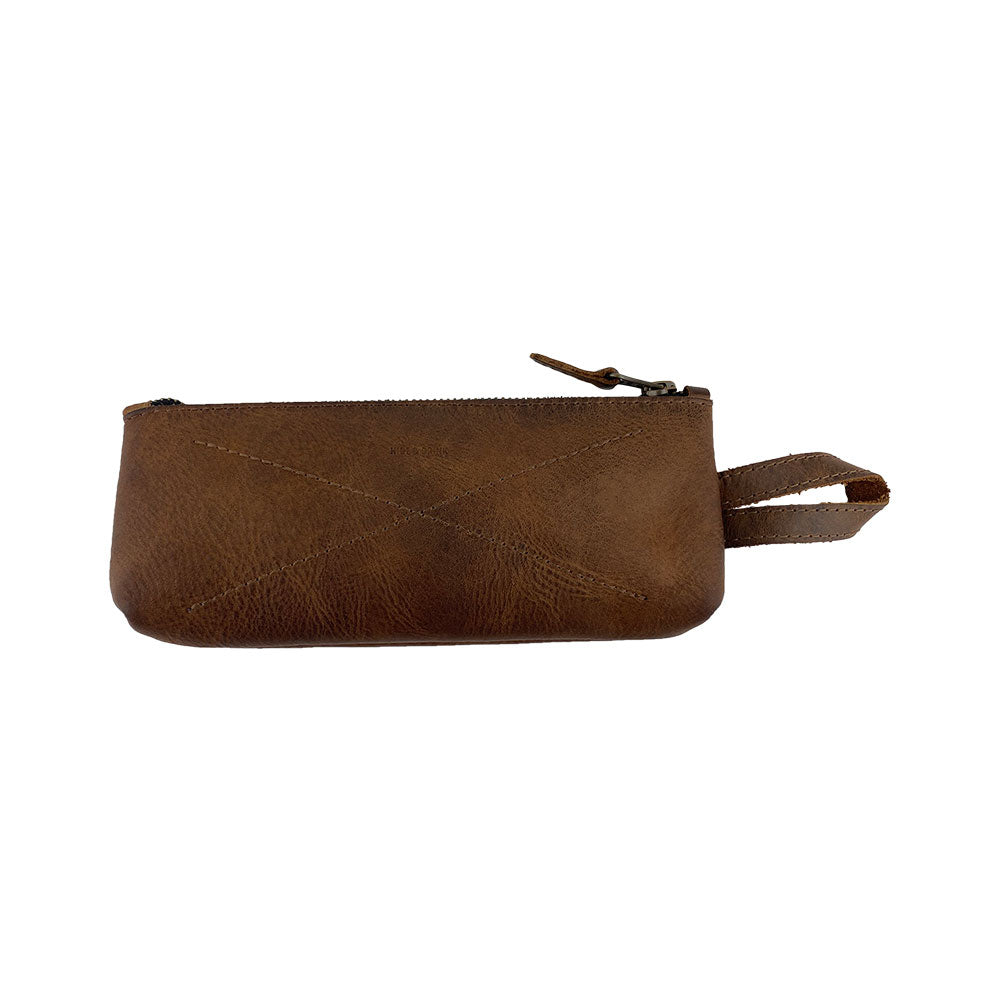 Hide & Drink's X Stitched Case, a handcrafted pen and pencil case made from durable full grain leather, perfect for travel essentials and storage for utensils. This small batch production item is hand cut and hand sewn by artisans in La Antigua Guatemala and Oaxaca, Mexico.