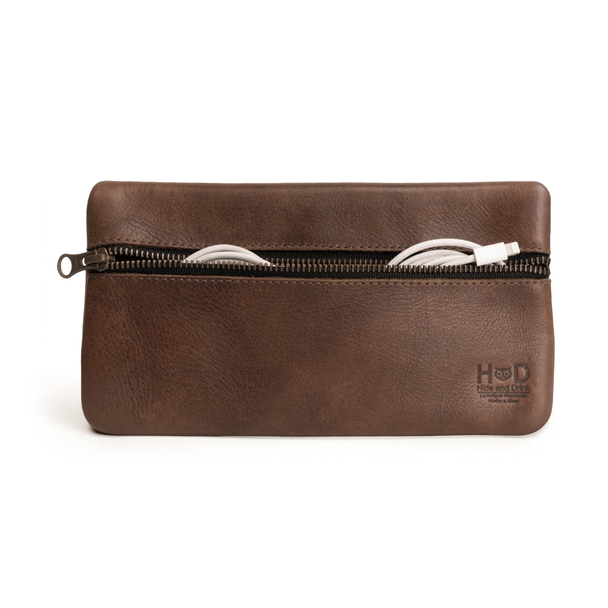 Hide & Drink Utility Cord Pouch made from full grain leather, featuring a zippered closure. Ideal as an all-purpose utility and charger case for MacBook, iPad & Laptop, and a cable organizer, perfect for travel. Hand cut and sewn, this artisan bag is handmade in La Antigua Guatemala & Oaxaca Mexico.